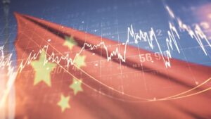 Imagem de gráficos sobrepostos à bandeira da China em alusão ao comportamento do mercado financeiro no que se refere a esse país Vale VALE3