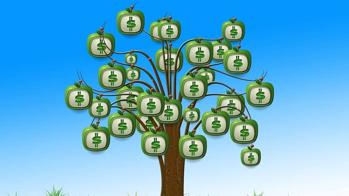 Imagem representando os juros sobre capital próprio, mostrando uma árvore onde os frutos são cifras de dinheiro.